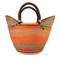 A woven tote bag with a geometric pattern in beige, brown, orange, red, and yellow, featuring two thick braided handles