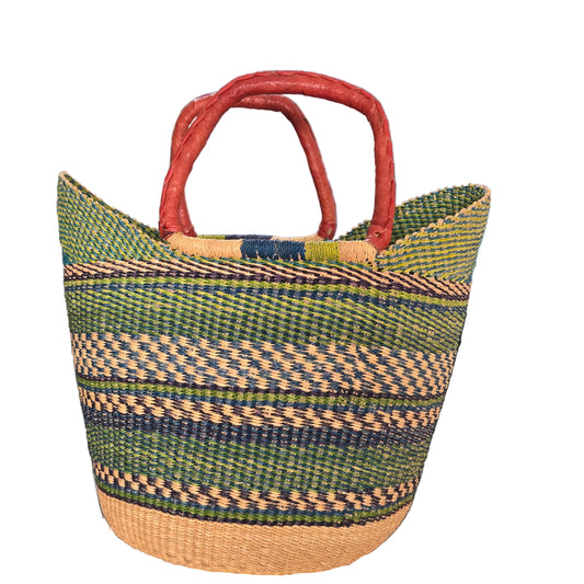 A woven straw tote bag with green, beige, and navy stripes, featuring thick reddish-brown handles.